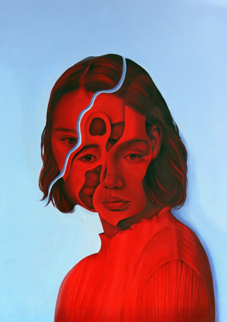 Arte de Celia Gallego, cuadro en azul y rojo con un rostro deconstruido.